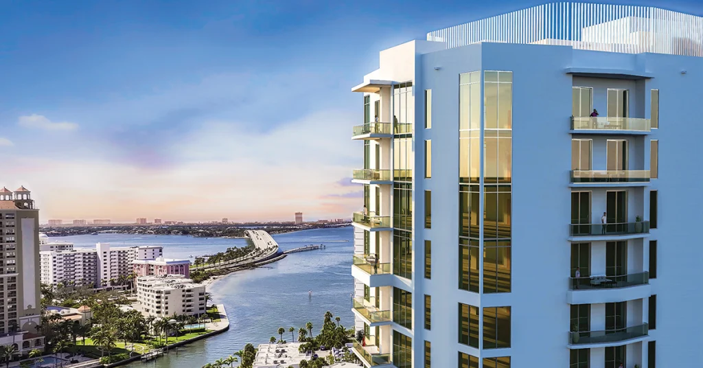 Exterior rendering of a modern waterfront condominium tower overlooking Sarasota Bay