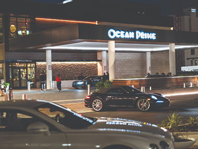 Ocean Prime restaurant exterior at night along Sarasota’s waterfront.