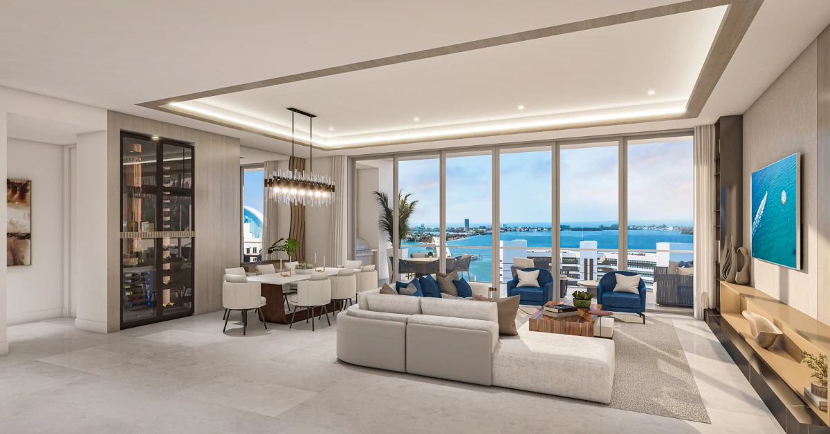 Contemporary great room with sectional seating, dining area, terrace, and floor-to-ceiling windows over water.