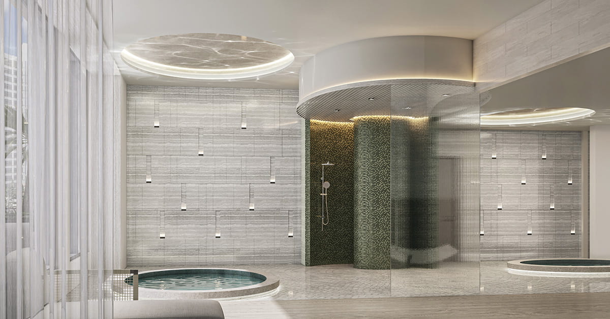 Luxury spa interior with plunge pools, shower, glass enclosure, stone walls, and lounge seating.